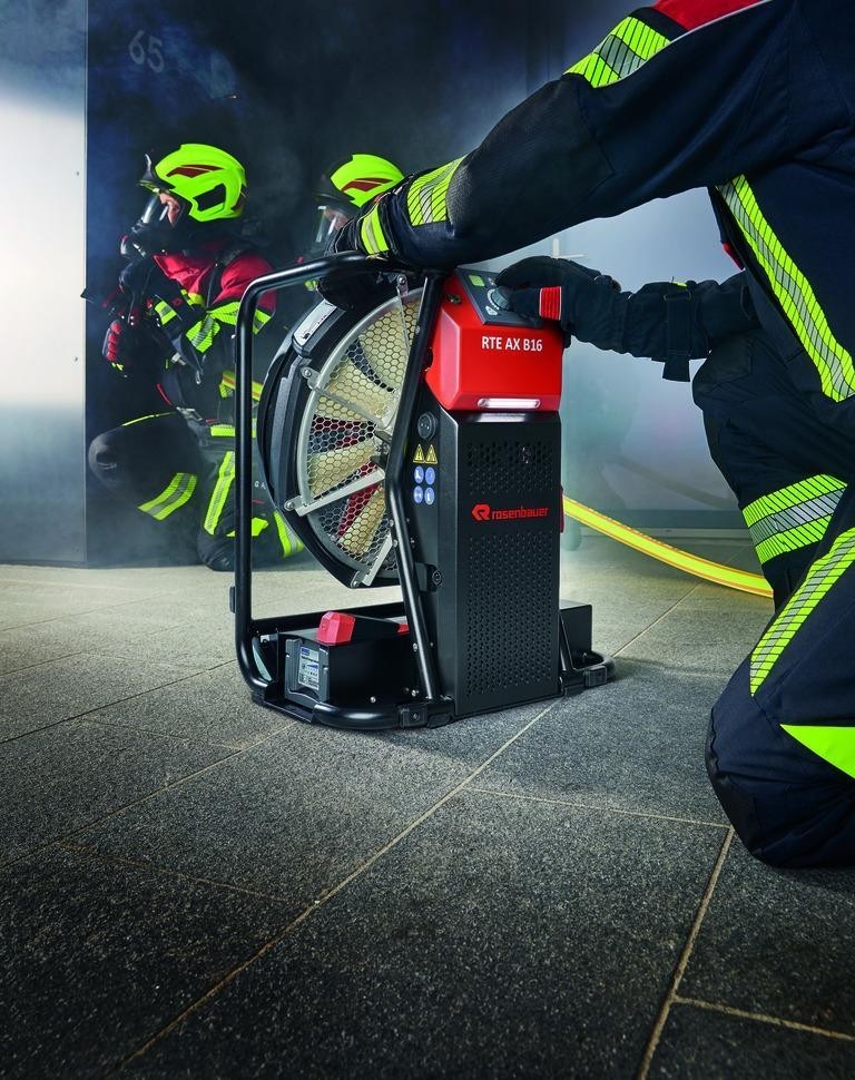 Portable smoke extraction fan used by firefighters